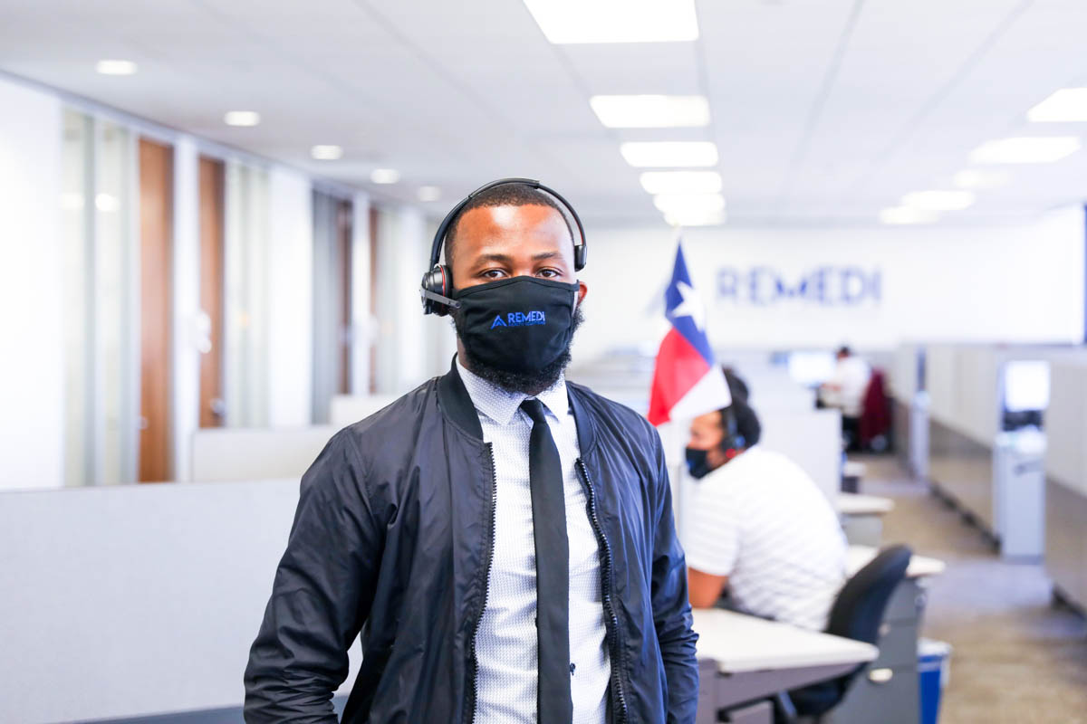 EHR support person standing in ReMedi Virtual Command Center
